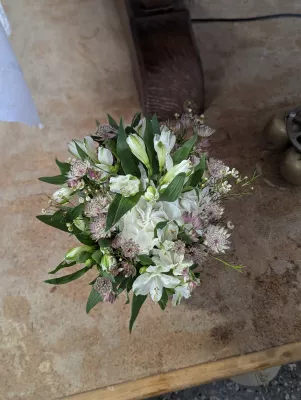 Small sophisticated rustic toss bouquet with white alstroemeria and pink astrantia.