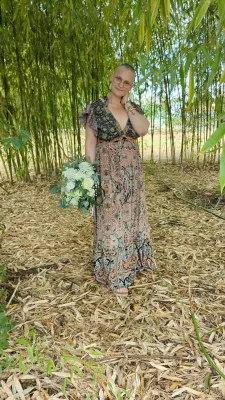 Sophisticated country-style bridal bouquet with white and pale pink roses, gypsophila, and eucalyptus.