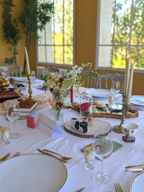 Sophisticated rustic table centrepiece with cream rose, white delphinium and orange alstroemeria for a wedding.