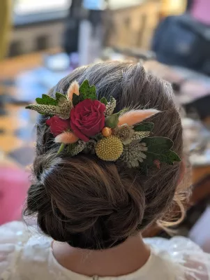 Romantic Organic Bridal Hairpiece featuring Red Rose, Yellow Crassula, and Green Foliage.