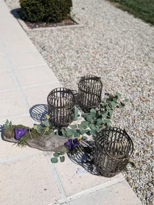 Sophisticated country garden composition with eucalyptus and purple blooms, outdoor decor, wedding.