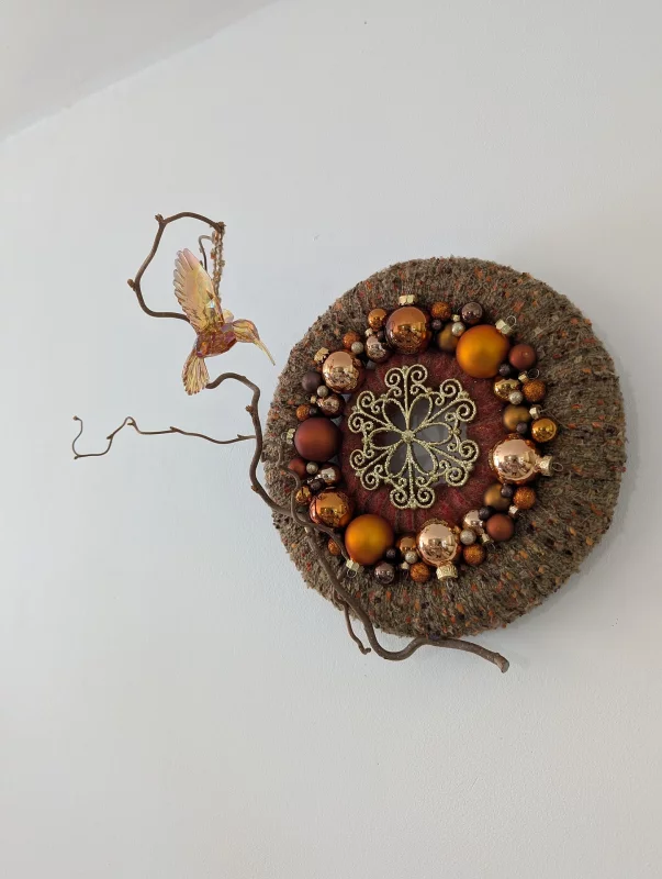Bohemian Wedding Wall Wreath with intertwined dried branches, gold and brown embellishments, for an autumnal touch.