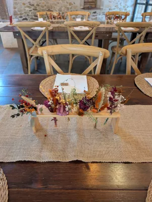 Rustic-chic Head Table Décor with orange, terracotta and burgundy dried flowers.