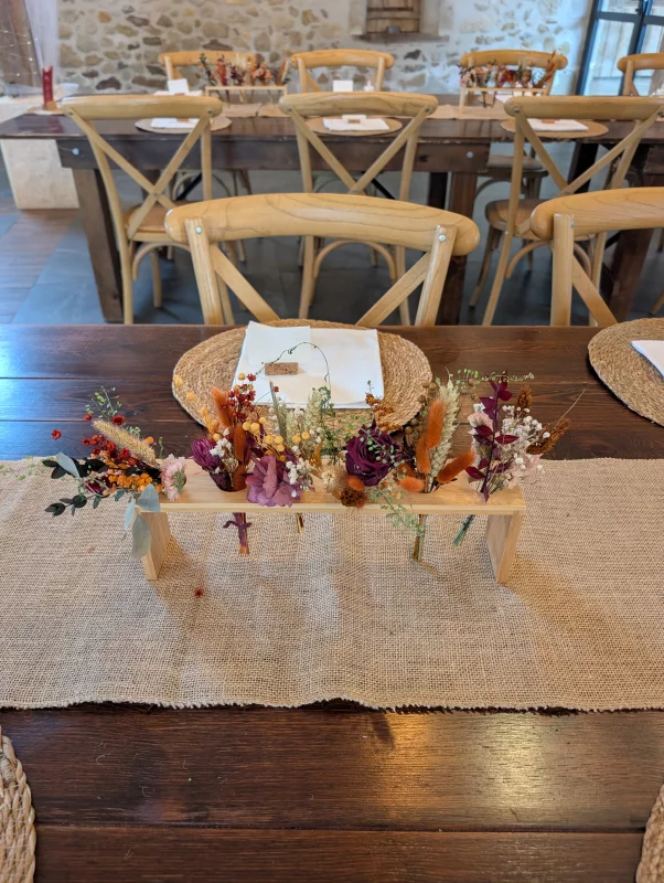 Rustic-chic Head Table Décor with orange, terracotta and burgundy dried flowers.