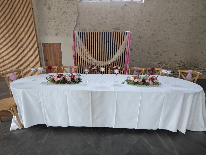 Romantic Organic Head Table with Floral Arrangements and Floating Candles for a Wedding.