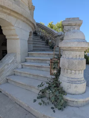 Romantic organic eucalyptus greenery along the château's staircase, wedding.