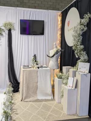 Contemporary botanical styling featuring spiralling white gypsophila and elegant table arrangements for the 2024 Wedding Fair.